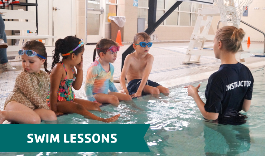 group of children participating in swim lessons